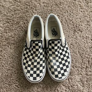 Vans checkered low top slip on shoes.